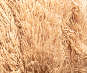 Beige shag carpet as an abstract background. Texture