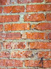 Old red brick wall as an abstract background. Texture