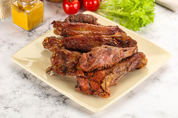 Roasted duck wings with sauce