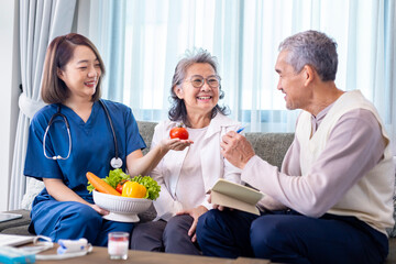 Senior couple got medical advice visit from caregiver nutritionist at home while having suggestion on fresh vegetable meal for healthy eating on probiotic and better digesting system - obrazy, fototapety, plakaty