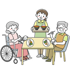 笑顔で食事をするシニアの男女と配膳をする女性スタッフ