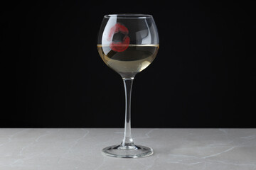 The impression of a kiss on a glass.