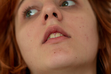  close-up portrait of a pensive teenage girl with red hair with a stylish anime hairstyle