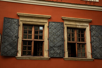 Fototapeta na wymiar The wall of an old house with windows