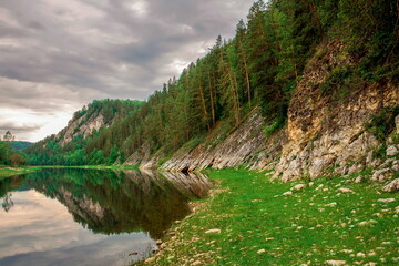 beautiful Belaya river flowing in the Southern Urals among rocky mountains and forests on a summer day