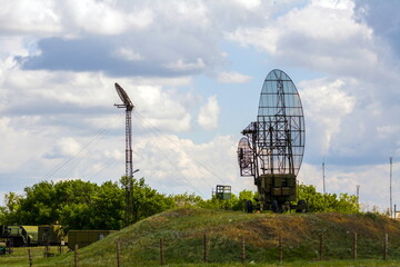 Radio relay military communications antenna against a blue sky