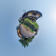 indian town on little planet in blue sky, transformation of spherical 360 panorama. Spherical abstract view with curvature of space.