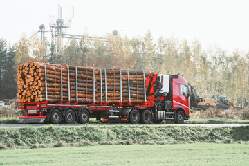 Loaded Timber Truck with Manipulator: Forest Transportation Concept. Heavy-Duty Truck with Lumber...