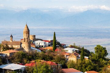 travel to Georgia - Sighnaghi town with cathedral over Alazan valley in Kakheti region in Georgia on sunny autumn evening
