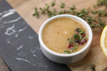 Delicious turkey gravy, thyme and peppercorns on board, closeup. Space for text