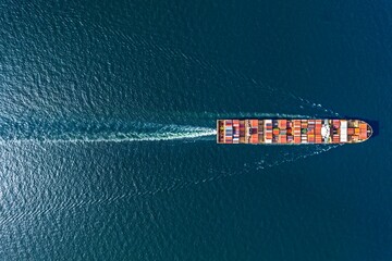Aerial top view container ship in export and import business and logistics. Shipping cargo to harbor by crane. - obrazy, fototapety, plakaty