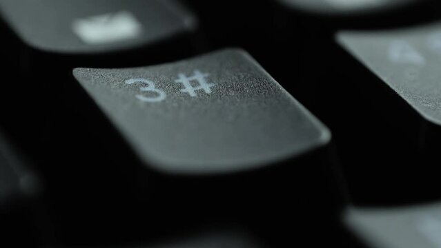 Keyboard button 3. Macro shot of finger pressing three button