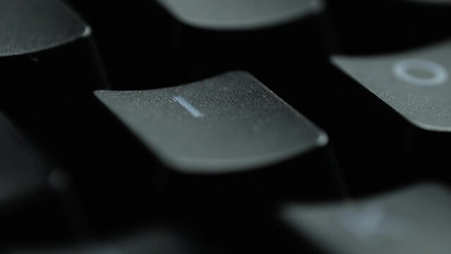 Keyboard button I. Macro shot of finger pressing I button