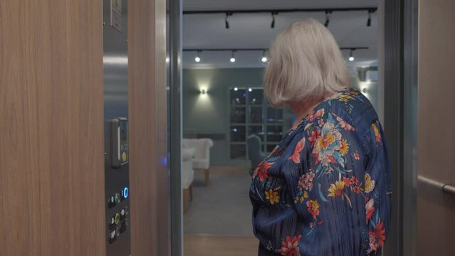 Elderly Woman Using Elevator in French Retirement Home