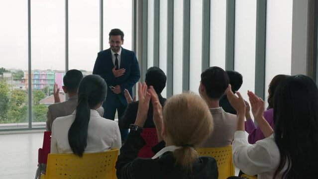 Commendable achievement Diverse business team claps hands, acknowledging the success of a new product in a vibrant office setting. Collaborative spirit, motivation, and teamwork shine through.