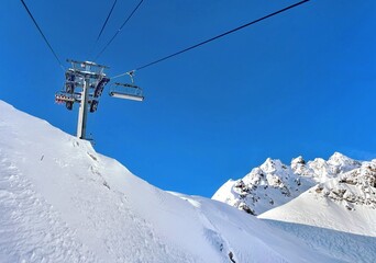 closeup on Ski lift; in beautiful snowy mountains under blue sky at Tignes resort France