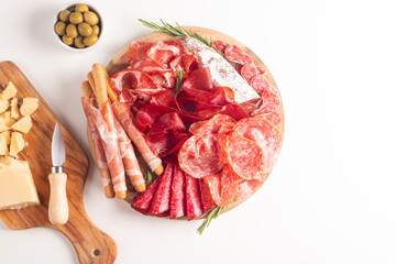 Charcuterie board. Antipasti appetizers of meat platter with salami, prosciutto crudo or jamon and olives. - 692426713