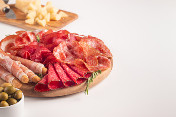 Charcuterie board. Antipasti appetizers of meat platter with salami, prosciutto crudo or jamon and olives.