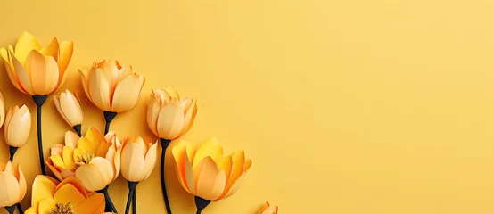 Poster Im Rahmen Tulips on yellow background. © Simon