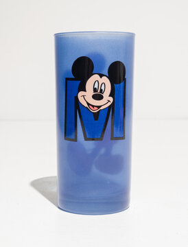 kent, uk, 01.01.2023 Disney Mickey Mouse Tall blue Drinking Glass from disney store. Exclusive Rare vintage. Disney memorabilia from the past. classic disney object