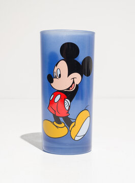 kent, uk, 01.01.2023 Disney Mickey Mouse Tall blue Drinking Glass from disney store. Exclusive Rare vintage. Disney memorabilia from the past. classic disney object
