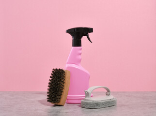 Household life and cleaning supplies. Scrubbing brush with thick bristles and spray bottle with...