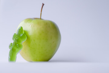 Candy and apple. Green apple candy. Flavor of sweets. Shallow depth of field. Copy space. 