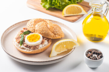 Delicious tuna open sandwiches. Buns with canned tuna, lemon, cream cheese and boiled egg.