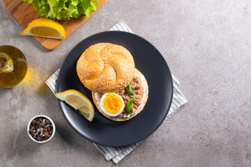 Delicious tuna open sandwiches. Buns with canned tuna, lemon, cream cheese and boiled egg.