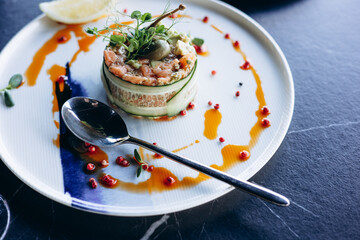 Healthy salad on white plate in a cafe