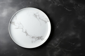 Empty white plate on black marble background, top view. Mockup for design, empty podium product place