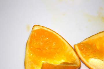 slice of orange. orange remains in food. food remains. remains with selective focus.