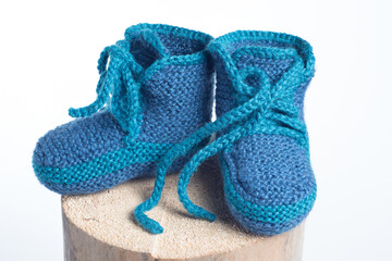 winter baby knitted woolen shoes isolated on white background