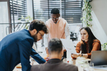Multiracial Business Group Collaborating on Strategy and Market Analysis in Corporate Office.