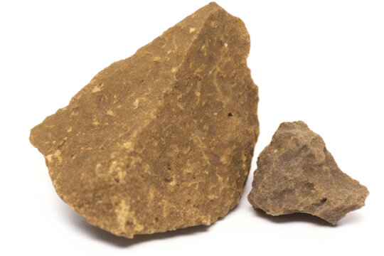 Piece of pressed hashish on white background, close-up