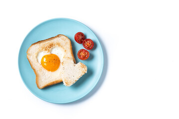 Valentine's Day breakfast with egg with tomatoes, heart shaped and toast bread isolated on white background. Top view. Copy space