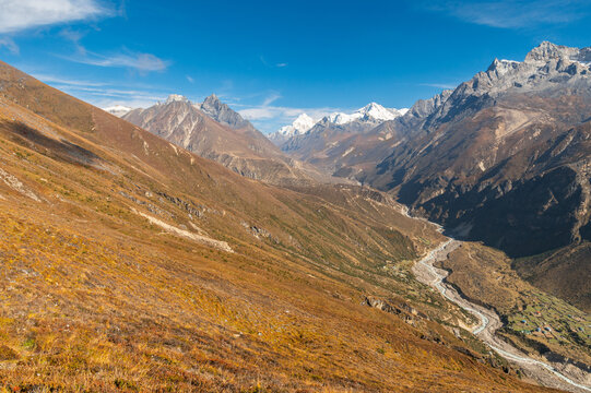 View from the Sunder Peak to the Himalayas and river Bhote Koshi. View of mountains Cho Oyu, Nangpal Gosum during trekking in  Sagarmatha, Nepal in a clear day. Three passes trek in Nepal.