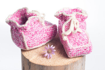 winter baby knitted woolen shoes isolated on white background