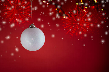 Fototapeta premium New Year's toys, decorations and other items on a red abstract background.