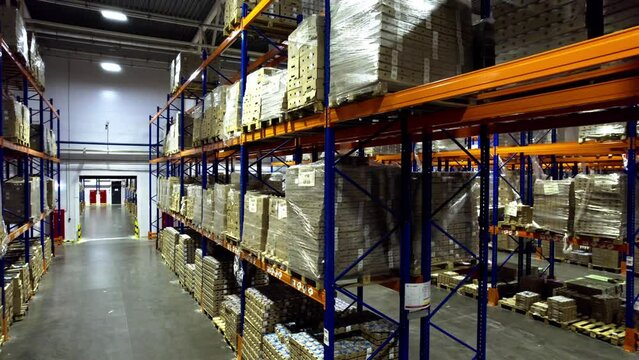 Enormous storehouse located in industrial area with variety of industrial commodities. Warehouse stocked with components ready for dispatch