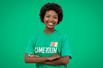 Beautiful football supporter from Cameroon with green jersey