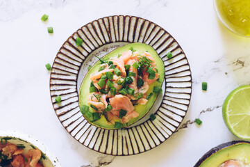 Healthy salad with avocado, smoked salmon, green onion and dill