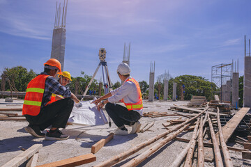 Structural engineer or architect and foreman worker with blueprints discuss, plan working for the...