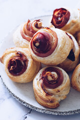 Puff pastry swirls. Close-up of puff pastry with prosciutto.