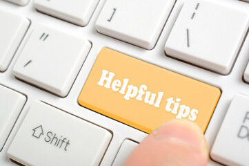 Pressing helpful tips key on keyboard