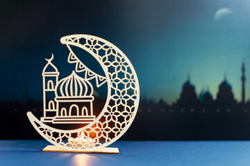 Islamic greeting Ramadan Kareem card design with candle and crescent.