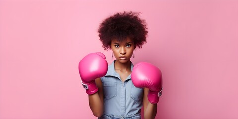 Afro girl with boxing glove on pink background, copy space - obrazy, fototapety, plakaty