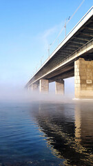 Bridge in frosty fog.
