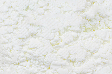 Cottage cheese Pattern. Fresh grainy cottage cheese or feta as a textured background