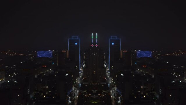 Aerial footage of night city, Neon illuminated contours of high rise downtown buildings. Dallas, USA. Abstract computer effect digital composed footage